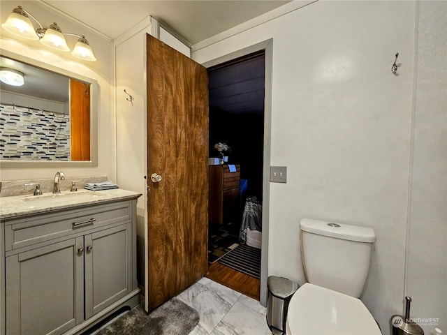 bathroom featuring vanity and toilet