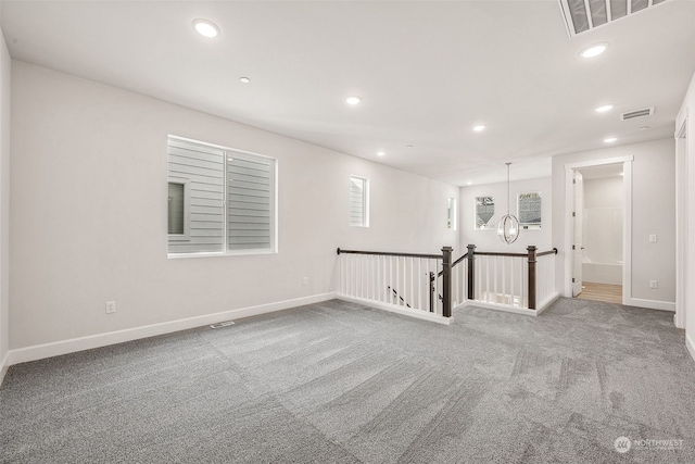 unfurnished room featuring carpet flooring