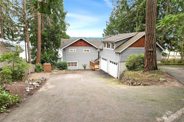 view of side of home featuring a garage