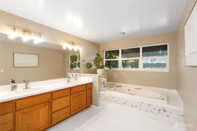 bathroom featuring tile patterned flooring, a relaxing tiled tub, and vanity