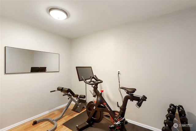 exercise area featuring hardwood / wood-style floors