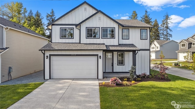 view of front of house with a garage and a front lawn