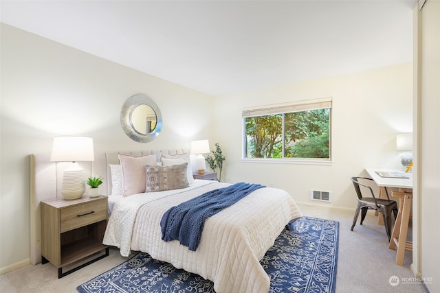 bedroom featuring light carpet