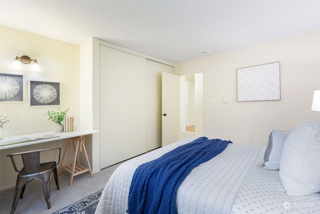 carpeted bedroom with a closet