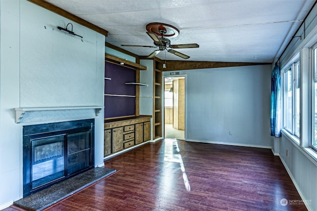 unfurnished living room with dark hardwood / wood-style floors, vaulted ceiling, and ceiling fan