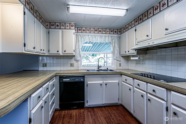 kitchen featuring dark wood-type flooring, black appliances, white cabinets, sink, and decorative backsplash