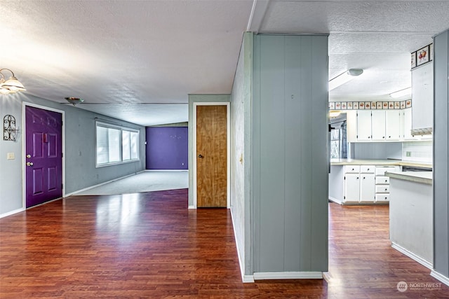 interior space with hardwood / wood-style flooring and a textured ceiling