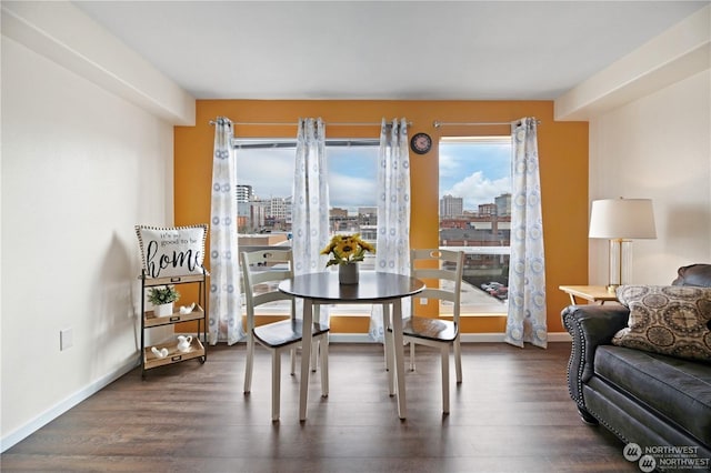 dining area featuring dark hardwood / wood-style floors