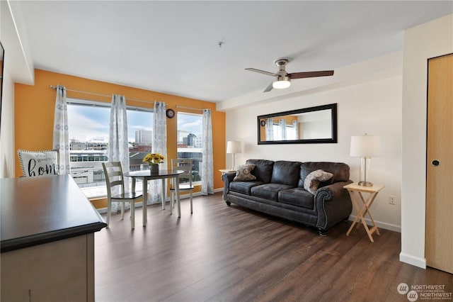 living room with dark hardwood / wood-style floors and ceiling fan