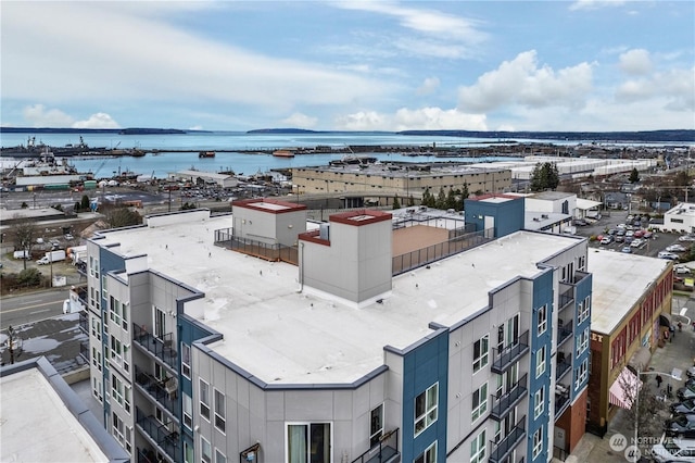 birds eye view of property with a water view