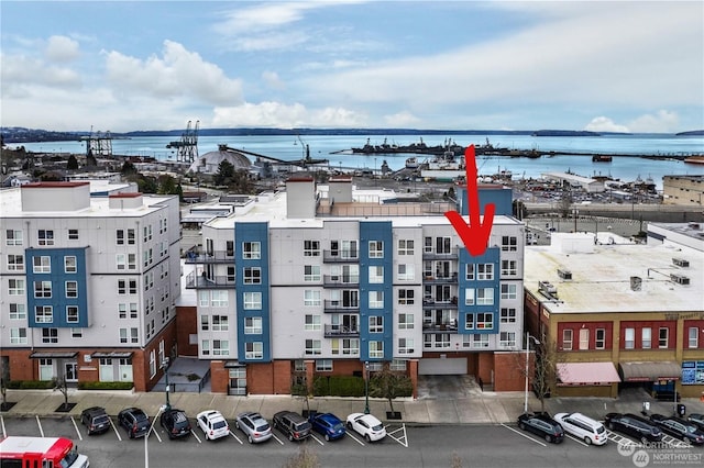 birds eye view of property featuring a water view