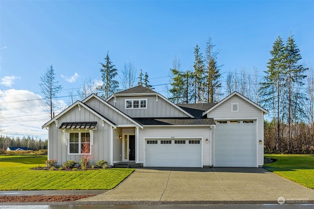 view of front of house with a garage and a front yard