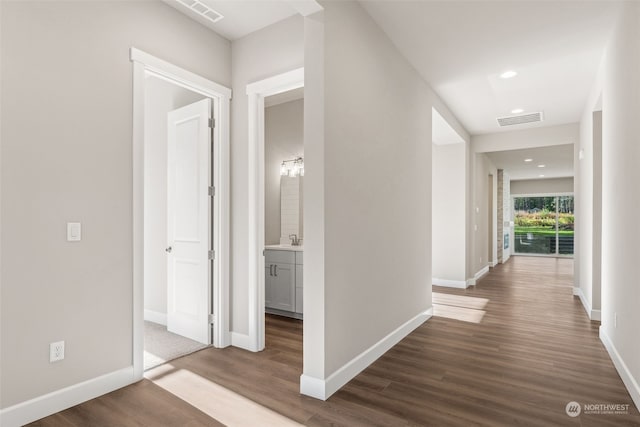 corridor with dark wood-type flooring