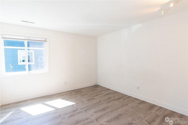 empty room with light wood-type flooring