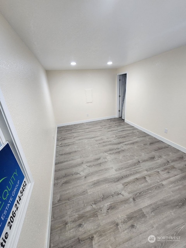 empty room with light hardwood / wood-style flooring