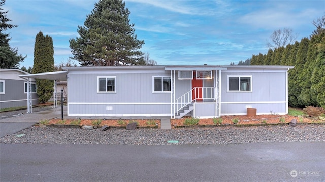 manufactured / mobile home featuring a carport