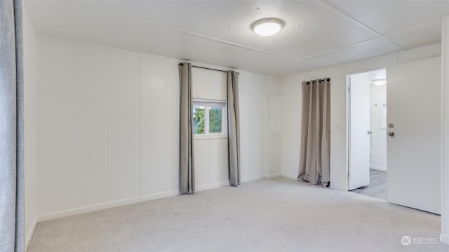 unfurnished room with light carpet