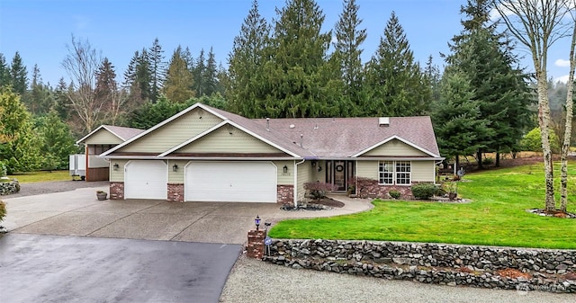 view of front of house with a garage and a front lawn