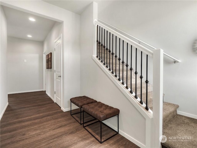 stairway with hardwood / wood-style floors