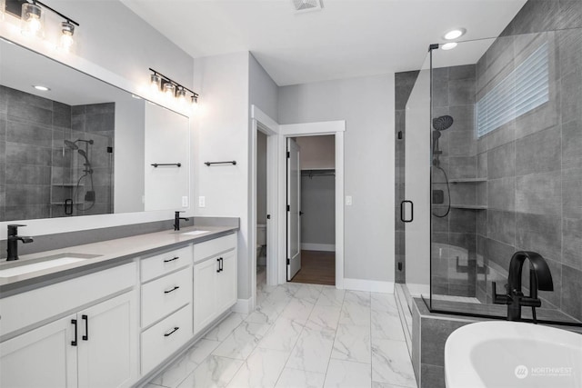 bathroom featuring vanity and walk in shower