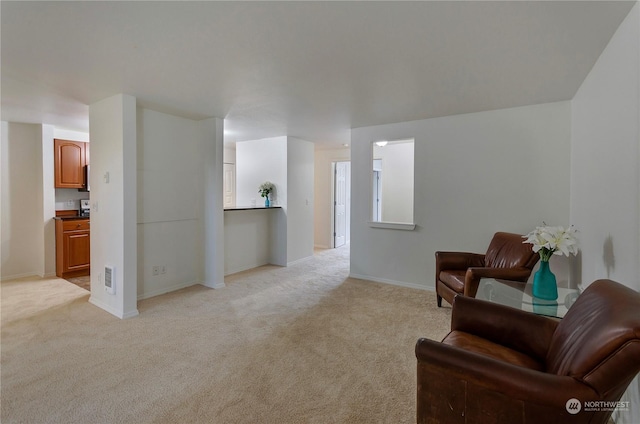 sitting room with light carpet