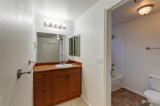 full bathroom featuring bathtub / shower combination, vanity, and toilet