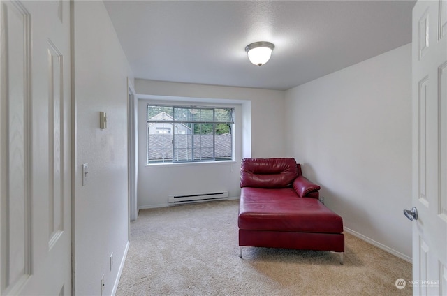 living area featuring light carpet and a baseboard radiator