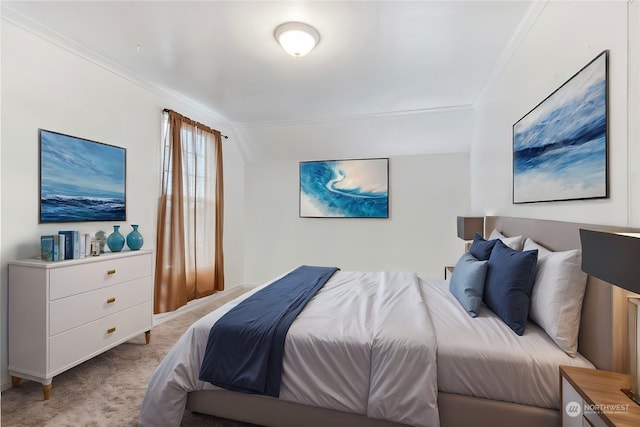 bedroom featuring crown molding, light colored carpet, and vaulted ceiling