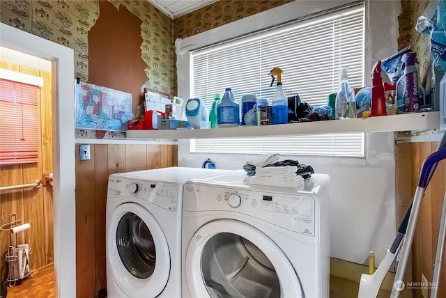 laundry area with parquet flooring and washer and clothes dryer