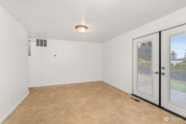 empty room with light colored carpet