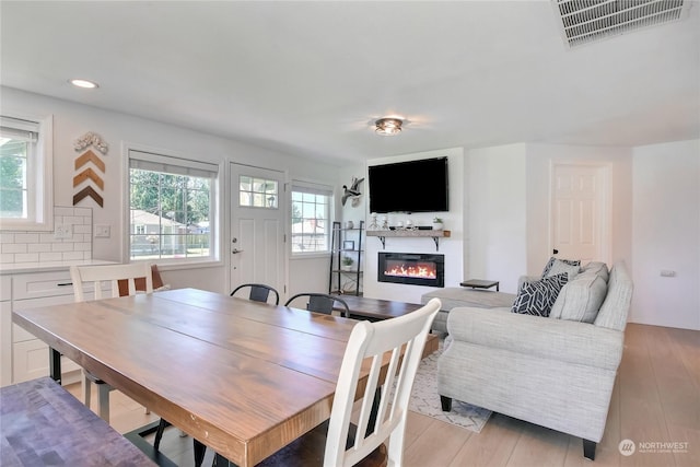 dining area featuring light wood-type flooring