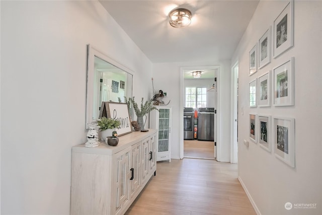 hall with light hardwood / wood-style floors