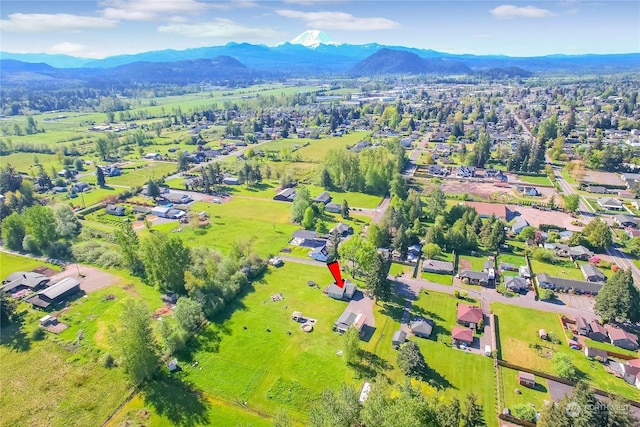 birds eye view of property featuring a mountain view