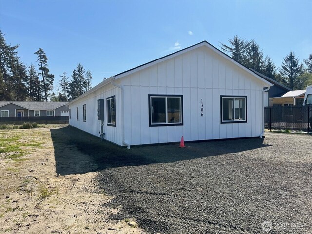 1306 Melbourne Ct, Westport, WA 98595 - view of property exterior with board and batten siding and fence