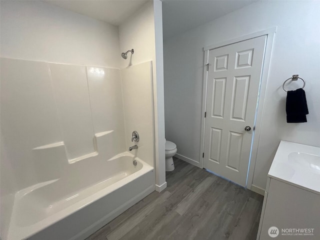 1306 Melbourne Ct, Westport, WA 98595 - bathroom featuring vanity, toilet, washtub / shower combination, and wood finished floors