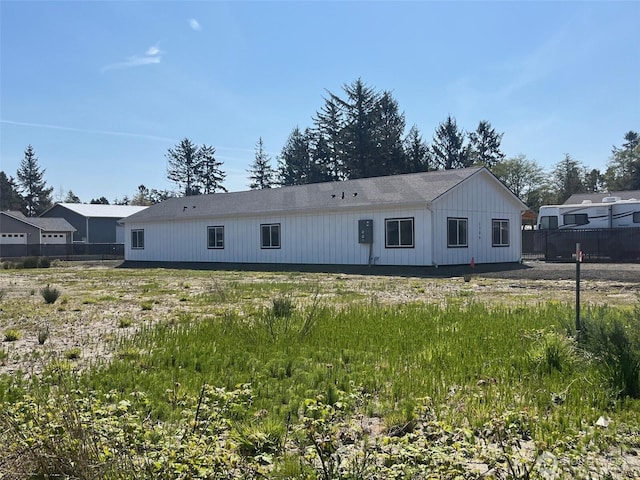 1306 Melbourne Ct, Westport, WA 98595 - view of front of home with board and batten siding and fence