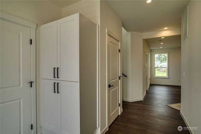 hallway featuring dark hardwood / wood-style flooring