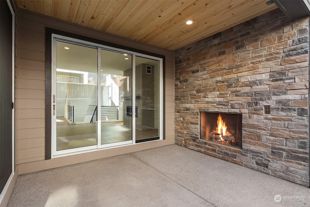 interior space featuring a stone fireplace