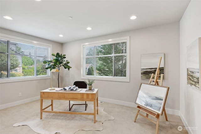 office area with light colored carpet and a healthy amount of sunlight