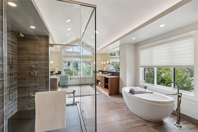 bathroom featuring vanity, plenty of natural light, and shower with separate bathtub