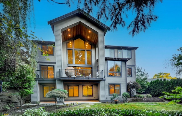 rear view of house featuring a balcony