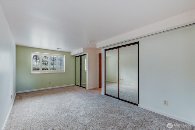 unfurnished bedroom with light carpet