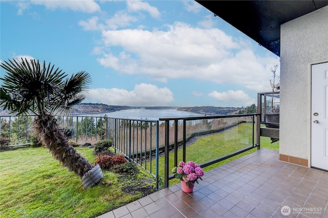 balcony featuring a water view