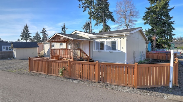 view of front of home with a storage unit