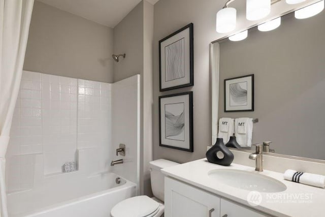 full bathroom featuring shower / tub combo, vanity, and toilet