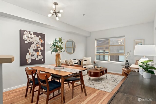 dining space featuring a notable chandelier and hardwood / wood-style flooring