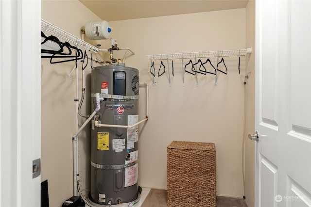 utility room featuring water heater