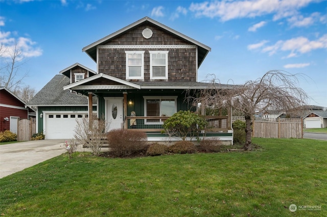 view of front of home with covered porch, a front lawn, and a garage