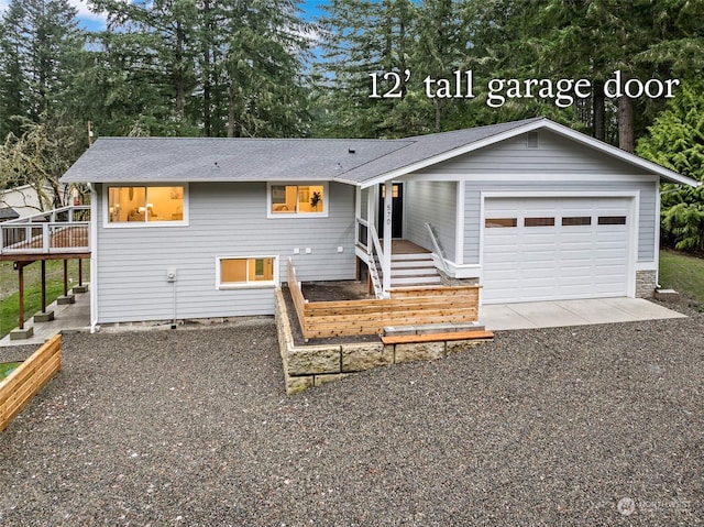 view of front of property featuring a wooden deck and a garage