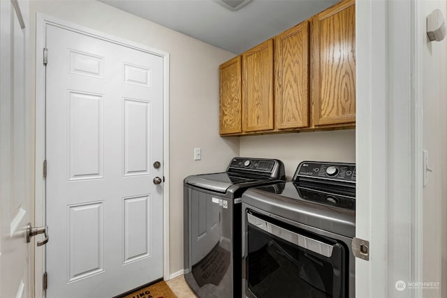 laundry area featuring cabinets and independent washer and dryer